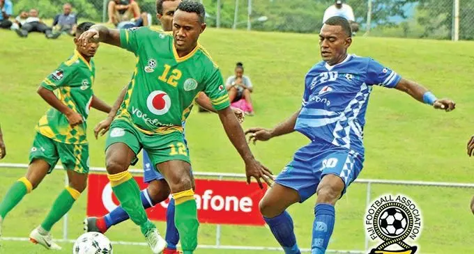 Veteran Nadi defender Ame Votoniu  gets to the ball ahead of Lautoka’s Ratu Bainivalu during their Vodafone Fiji FACT 2020 opener at Churchill Park, Lautoka , on November 21, 2020. Nadi won 1-0 to keep their title defence campaign on track. Photo: Fiji FA Media 