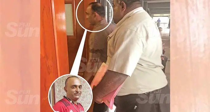 Hasim Khan (also in inset photo) escorted by Seaqaqa Police officer to Magistrate Court in Labasa on September 22, 2020. Photo: Shratika Naidu