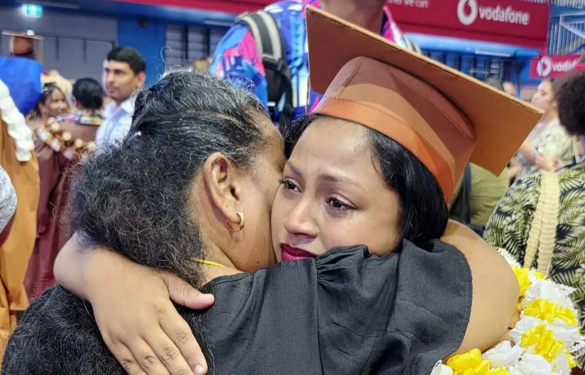 Noolyn Darshani Chand embraces her mother, Angely Wong Sang, during the University of the South Pacific graduation ceremony at the Vodafone Arena in Suva on April 17, 2026.