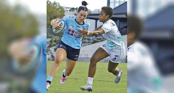 Rooster Chicken Fijiana Drua winger Adita Milinia tries to tackle a NSW Waratahs player during their Super W semifinal match on April 30, 2023. Photo: Waratahs Rugby Media