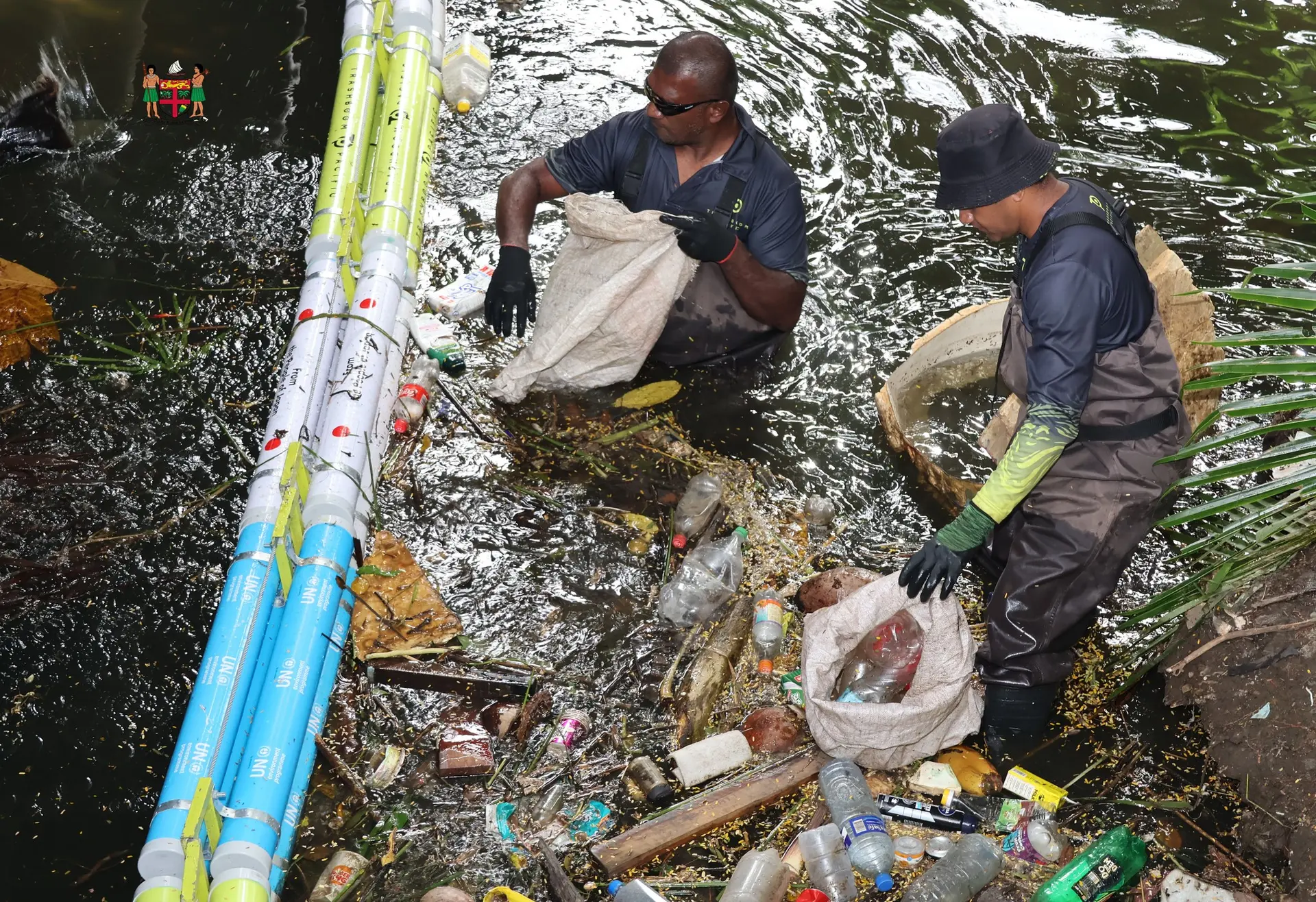 Waste flowing through Nabua’s waterways met another barrier yesterday, as a trashboom was installed to trap waste before it reached the sea.