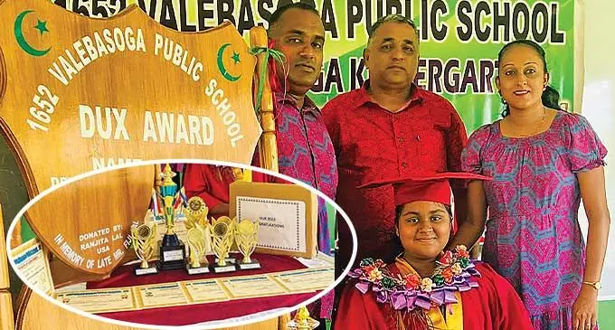 Valebasoga Public School dux Tanisha Singh with her parents Mukeshwar and Savita Singh and head teacher Mohammed Kamal (middle), in Labasa on December 5, 2023.