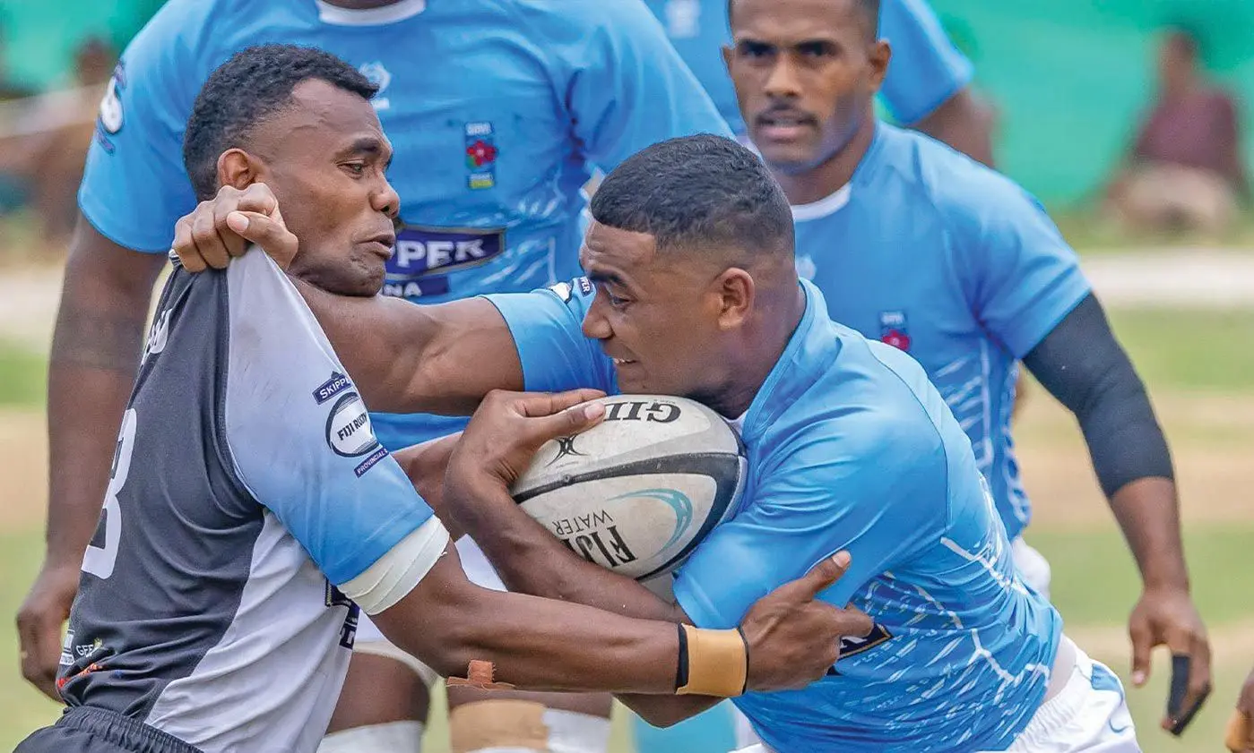 Suva rugby back Sevuloni Lutu (right) on attack against Malolo during Round 3 of the Skipper Cup clash at Yawini Park in Mana Island.