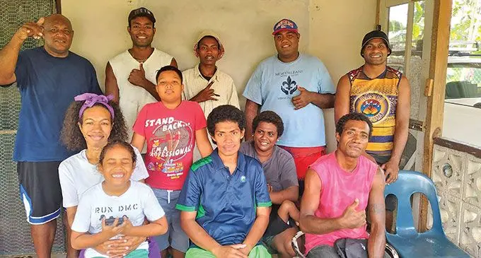 PYGMIES founder and president, Josateki Labalaba (standing first from left) with the youth members and community members of Natokowaqa in Lautoka.