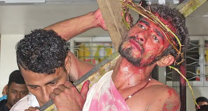 1. Youths from Raiwaqa dress up for the Easter crucifixion drama at St. Pius X Parish in Raiwaqa on April 19, 2019. 2. Rafaele Kasibulu of St. Pius X Parish in Raiwaqa, closest to cam- era, and Wise Valenivalu (left) depicting a helper during the Easter mass crucifixion drama on April 19, 2019. Photos: Ronald Kumar 