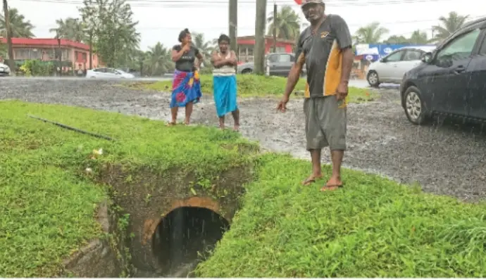  A resident of Nadera points to the drain where the boy drowned on  November 11, 2019.