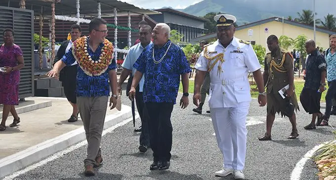 From left: The Australian Minister for International Development and the Pacific, Senator Zed Seselja, Prime Minister, Voreqe Bainimarama and the Republic of the Fiji Military Forces Naval Division, Commodore Humphrey Tawake walking through the Blackrock Peacekeeping and Humanitarian Assistance and Disaster Relief Camp in Nadi on March 14, 2022. Photo: Nicolette Chambers