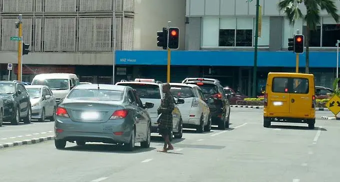 A teenager begs on the middle of a road in Suva. Photo: Ronald Kumar
