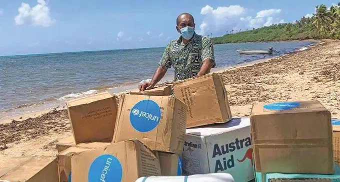 Minister for  Infrastructure and Meteorological Services Jone Usamate with supplies at Lukuni, Ono-i-lau during thier visit on January 22 2022.  Photo: NDMO