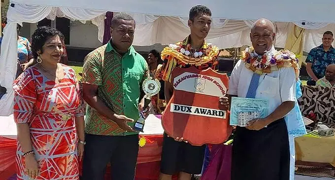 Permanent Secretary for Employment, Productivity and Industrial Relations Osea Cawaru (right), with Nakauvadra High School Dux for the year 2022, Ryan Sekiwai.