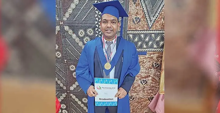 Ashneel Shankar with his masters certificate after the University of Fiji Graduation Ceremony on April 28, 2023.