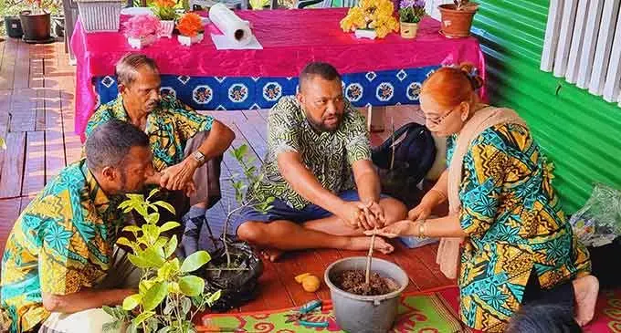 Senior Technical Assistant Officer for Seaqaqa Research Station, Usenio Akuila, (third from left) demonstrates the cleft grafting technique to members of the Orchid Cluster group in Wailevu Solove in Labasa. Photo: Sampras Anand