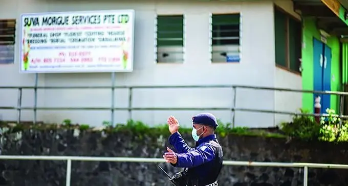 Police constable Terio Tamani directing traffic outside the mortuary at the Colonial War Memorial Hospital after they cordoned it off due to the movement of people around the area on 21 July 2021. Photo- Leon Lord