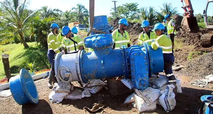 WAF crew members inspect a cross connection valve at the Waila Water Treatment Plant, during the partial Waila water shutdown earlier this year.  
