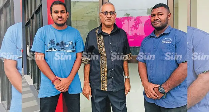 Kamlesh Chand is flanked by his son Ashneel Maharaj (left), and security officer, Isimeli Samuri, outside the soon-to-open Maharaj shopping centre in Samabula on April 8,2022.. Photo: Laisa Lui