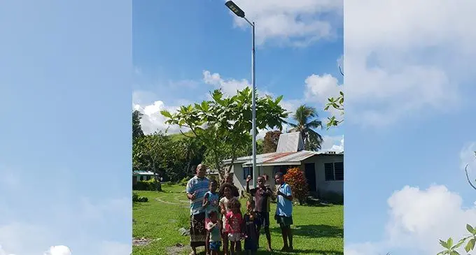 Lomolomo Village Turaga Ni Koro, Jolame Nailaruwai with the children in front of one out of the 22 solar street lights recently installed in the village. Photo: Nicolette Chambers