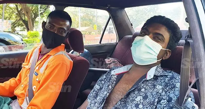 Manesh Reddy (left) after picking his brother, Ravinal Reddy (right) from the Lautoka Hospital on May 27, 2021. Photo: Nicolette Chambers