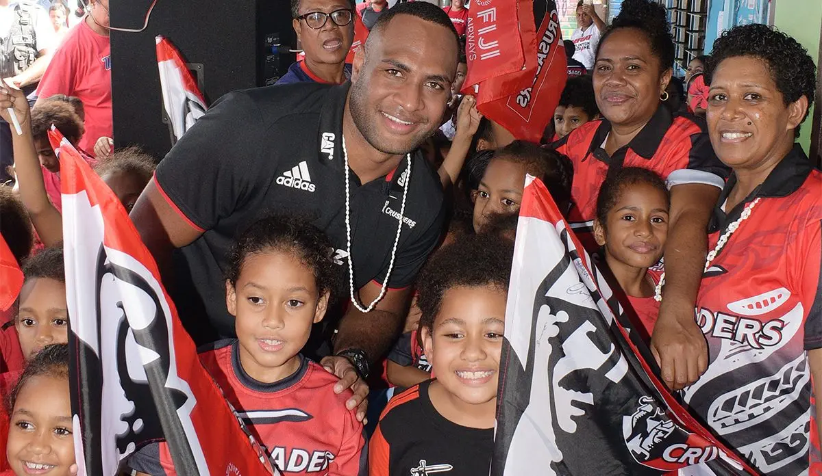 Crusaders outside Manasa Mataele with students and teachers of Holy Trinity Anglican Primary School during school visit on May 30, 2019. Photo: Ronald Kumar.