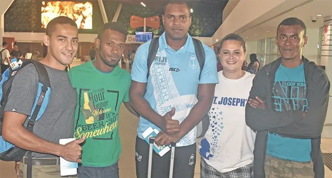 Fiji Airways Fijian 7s forward Josua Vakurunabili with fans at the Nadi International Airport on March 28, 2019. Photo: Waisea Nasokia