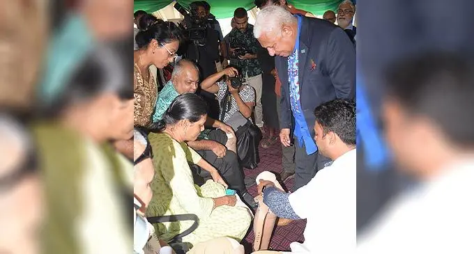 Prime Minister Voreqe Bainimarama (right) looked over as amputees received prosthetic legs and arm during Jaipur foot camp in Fiji on November 3, 2022. Photo: Ronald Kumar