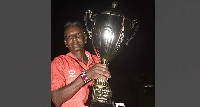 A loyal Labasa football fan Bissun Deo holds the Punjas Battle of the Giants Trophy after their 1-0 win over Lautoka in last year’s final. Photo: Fiji FA Media