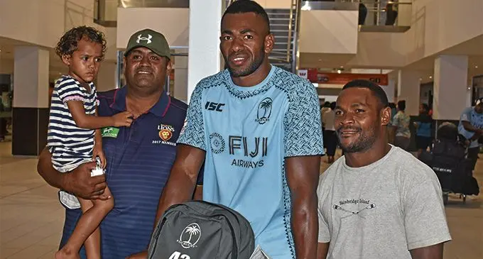 Fiji Airways Fijian 7s rep Sevuloni Mocenacagi with fans at the Nadi International Airport on February 4, 2019. Photo: Waisea Nasokia