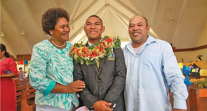 Ratu Kadavulevu School headboy Jonathan Matiavi flanked by his mother Raijeli Matiavi and father Sam Matiavi after the school’s prefects induction ceremony at Lodoni, Tailevu on May 1, 2022. Photo: Leon Lord