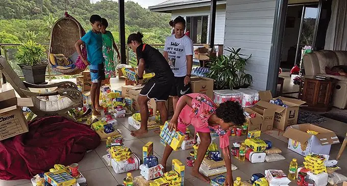 Make a Difference Fiji with the food ration packs ready for donation.
