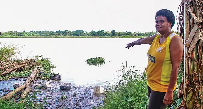 Naiyala Sub-division resident Kelera Nabaro points where the body of the unidentified man was found floating in the Rewa River on June 20, 2024. Photo: Kelera Sovasiga