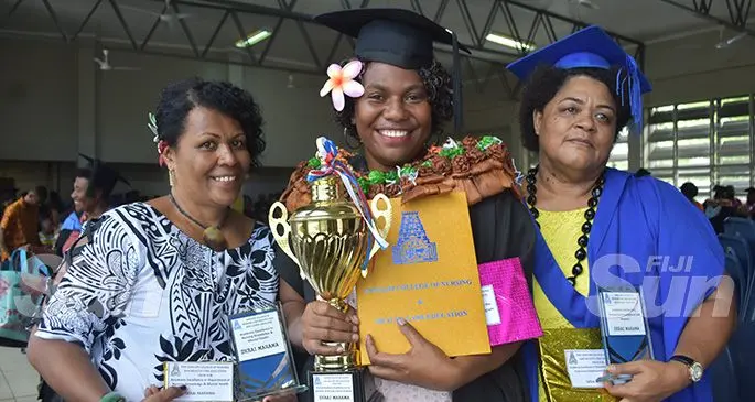 Sangam Institute of Technology (SIT) College of Nursing and Health Care Education graduate Serai Marama (middle) with her awards as she stands with her two lecturers, Meri Rabuka (right) and Litia Veitata, after the graduation at the Labasa Civic Centre on December 11, 2019. Photo: Shratika Naidu