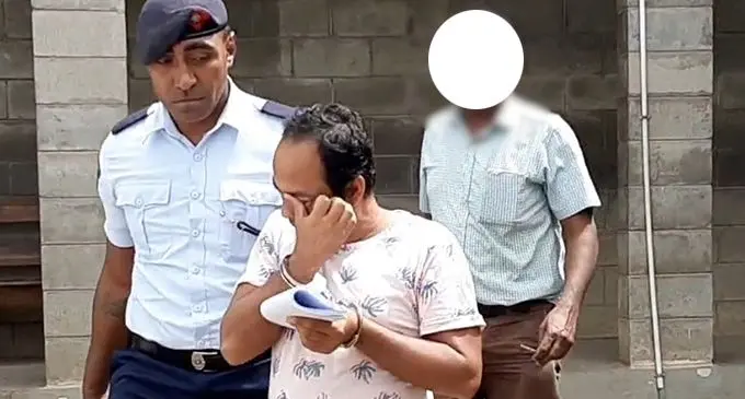 Mohammed Masum is escorted by Police at the Ba Magistrates court. Photo: Salote Qalubau