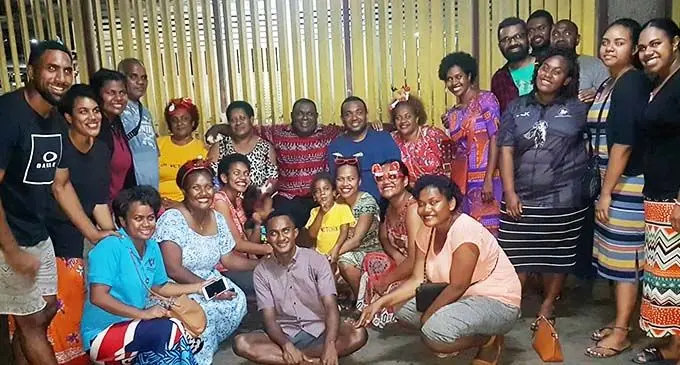 Fiji Sun journalist Adi Kelera Sovasiga (kneeling first from left) with the Fortunate Ministry members after handing out food packs and gifts to street dwellers at the Lautoka bus stand on December 22, 2019.