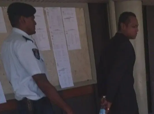 Accused Ritnesh Kumar with a police officer at the Lautoka Magistrate Court on December 9, 2025.