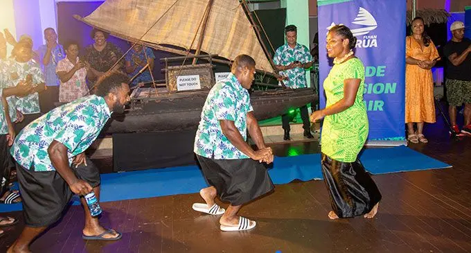 Swire Shipping Fijian Drua player Onisi Ratave (left) cheers on teamamte Peni Matawalu as he dances with a member of the Pasifika Voices during the team’s official welcome at the Fiji Museum in Suva on April 25, 2022. Photo: Leon Lord