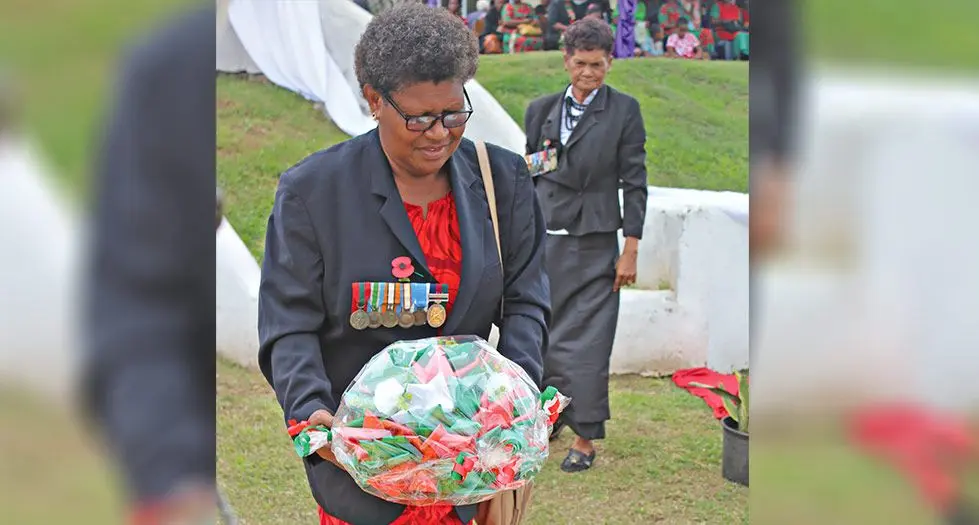 Meredani Sakealevu with a wreath to honour her late husband at Vaturekuka, Labasa.  Photo: Shratika Naidu
