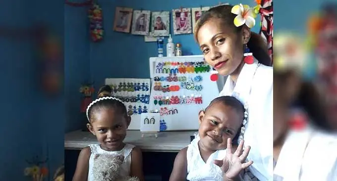 Aliti Biumaiwai with her daughters Hannah and Helena.