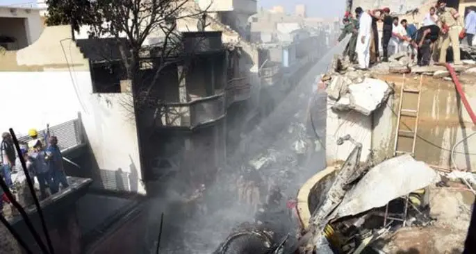 Rescuers work at the plane crash site in southern Pakistani port city of Karachi on May 22, 2020. (Xinhua/Stringer)