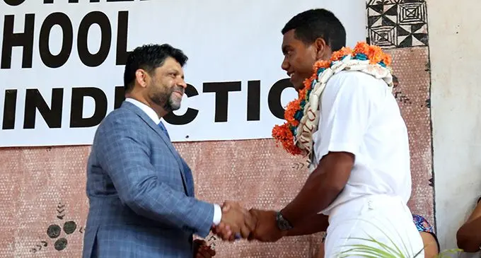 Chief guest Attorney-General Aiyaz Sayed-Khaiyum congratulates Marist Brothers High School head boy Joshua Lewenilovo during the school’s prefects induction ceremony on February 6, 2020 at Lambert Hall in Flagstaff, Suva.  Photo: Kelera Sovasiga