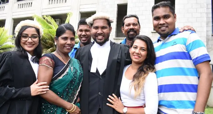 John Prasad (centre) with his family and friends following his admission as a Legal Practitioner on February 21, 2018. Photo: Ronald Kumar
