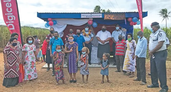 Divisional Police Commander (DPC) North Senior Superintendent of Police Tomasi Bulimaibau, Digicel Fiji Limited divisional manager North Livai Silatolu and Laqere Crime Prevention Committee president Sarda Prasad (standing back) with the committee members during the opening of the bus shelter in Laqere, Labasa on August 11, 2021.  Photo: Shratika Naidu