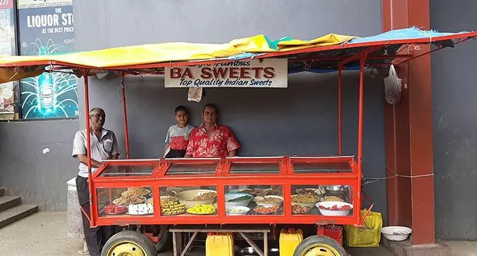 Virlesh Anand (right) with his son and uncle Kamal Sharma at their stall in Lautoka.