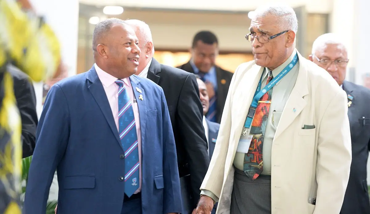 Minister of Defense Inia Seruiratu and Opposition MP Ratu Naiqama Lalabalavu outside Parliament on September 1, 2020. Photo: Ronald Kumar.