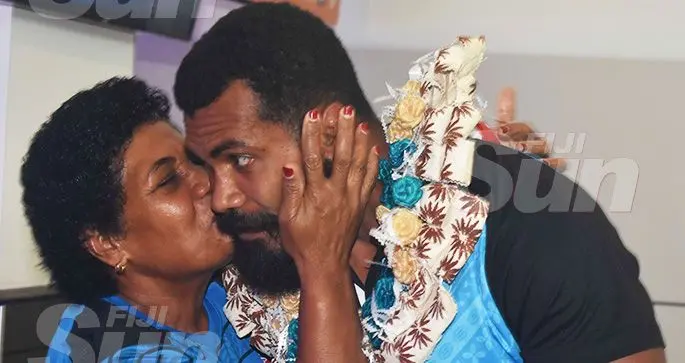 Fiji Airways Flying Fijians captain Domoniko Waqaniburotu is welcomed by a relative at Nadi International Airport on October 15, 2019 Photo: Waisea Nasokia