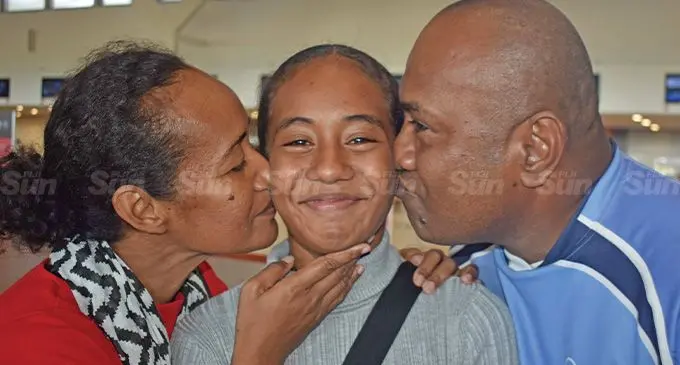 Leilani Naiyaga, with parents Seforosa Munivai and Apisai Naiyaga at the Nadi international Airport on June 9, 2022. Photo: Waisea Nasokia