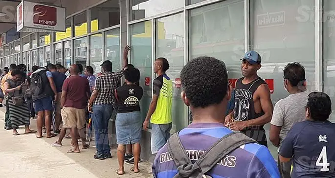 Members of the public wait in line at the Fiji National Provident Fund Lautoka branch on March 23,2020.Photo: Salote Qalubau