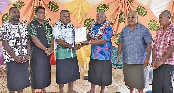 Minister for Fisheries and Forestry, Kalaveti Ravu (with garland) hands over the pine harvesting licence to Fiji Pine Trust manager Timoci Nabou (third from left) and with other stakeholders.