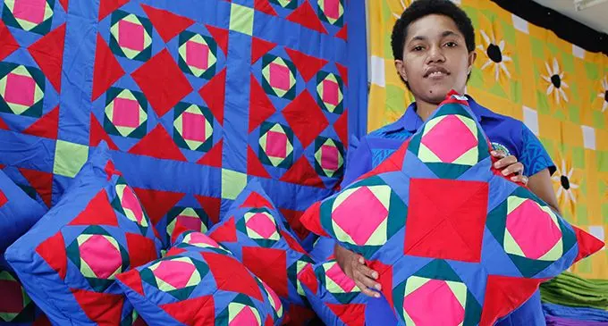 Maria Miriama holding a pillow she sewed at the Makoi Women’s Vocational Training Centre on May 4, 2019. Photo: Sydnee Gonzalez.