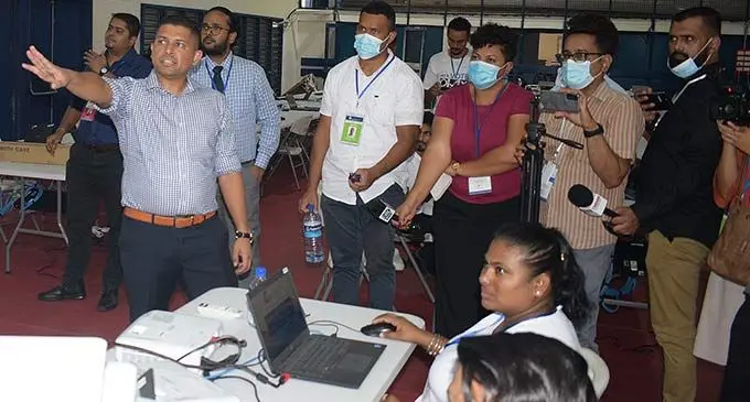 Supervisor of Elections Mohammed Saneem explains the vote counting process on December 13, 2022. Photo: Ronald Kumar.