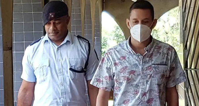 Bradley Robert Dawson escorted by a Police officer at the High Court in Lautoka on January 20, 2023. File Photo