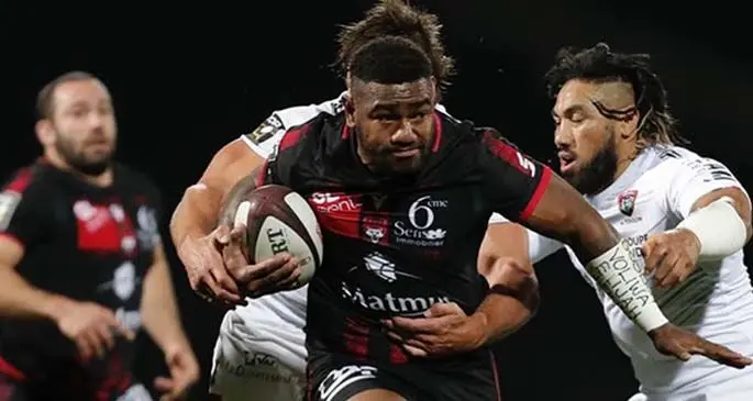 Josua Tuisova, bursts past the Toulon defender of Ma’a Nonu (right) during their Top 14 clash at the Matmut Stadium de Gerland in Lyon, France, on March 27, 2021. Tuisova scored two tries for Lyon in their 54-16 win while Nonu was red carded. Photo: French Top 14